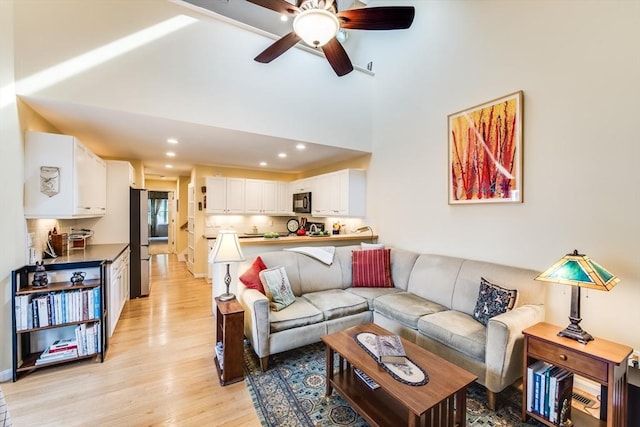 11 Alice Mullens Way Unit 11, Plymouth, MA 02360 - living area featuring light wood-style flooring, ceiling fan, recessed lighting, and a towering ceiling
