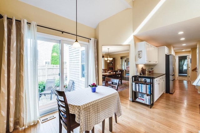 11 Alice Mullens Way Unit 11, Plymouth, MA 02360 - dining area with a chandelier, light wood-style flooring, high vaulted ceiling, and recessed lighting