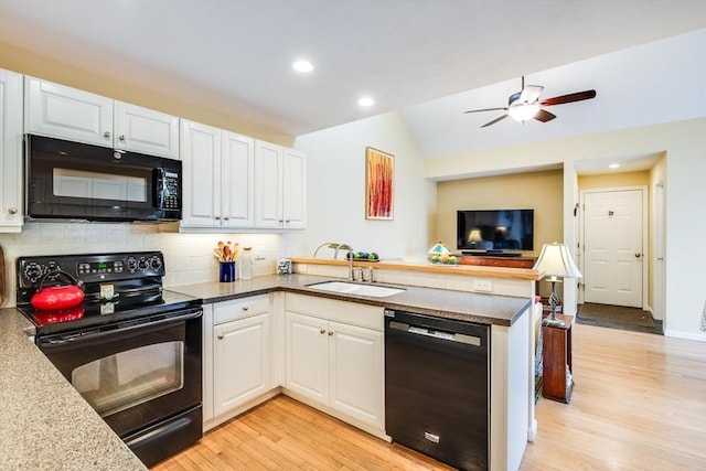 11 Alice Mullens Way Unit 11, Plymouth, MA 02360 - kitchen with black appliances, a peninsula, light wood-style flooring, a sink, and white cabinets