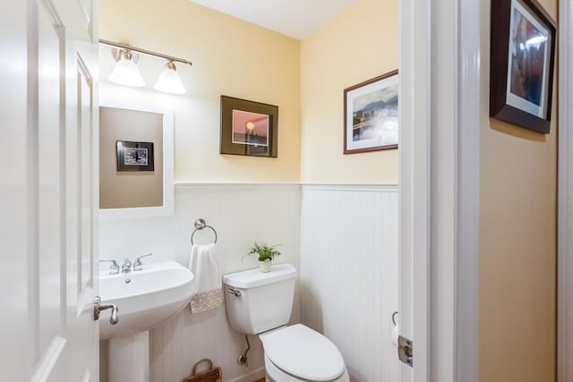 11 Alice Mullens Way Unit 11, Plymouth, MA 02360 - bathroom with a wainscoted wall, toilet, and a sink