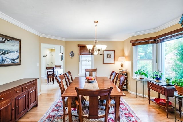 11 Alice Mullens Way Unit 11, Plymouth, MA 02360 - dining room featuring light wood finished floors, a chandelier, ornamental molding, and baseboards