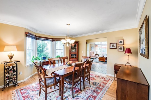 11 Alice Mullens Way Unit 11, Plymouth, MA 02360 - dining room with a chandelier, crown molding, baseboards, and light wood finished floors