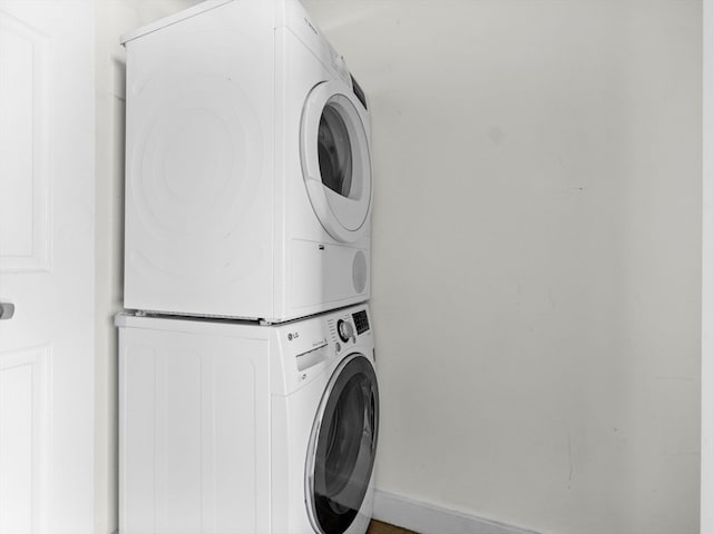 laundry area with stacked washer / drying machine