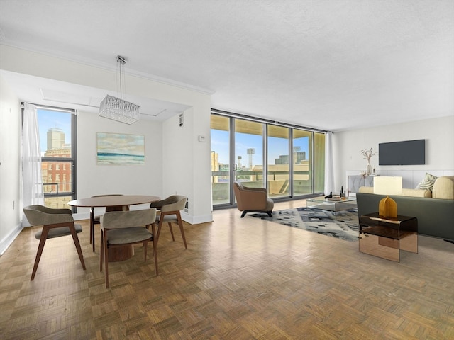 dining space featuring a textured ceiling, dark parquet flooring, and a wealth of natural light