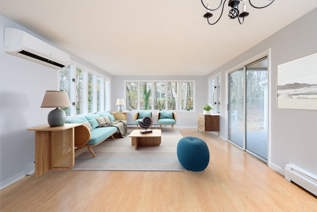 sunroom featuring a wall mounted AC, a baseboard radiator, and a notable chandelier