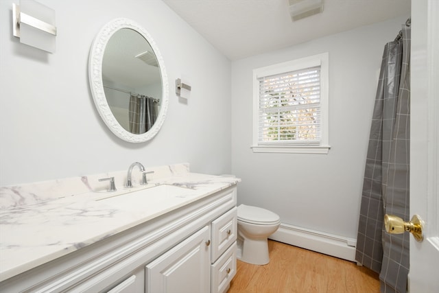 bathroom with vanity, a baseboard heating unit, hardwood / wood-style floors, toilet, and curtained shower