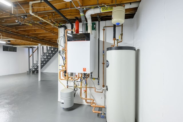 utility room featuring water heater