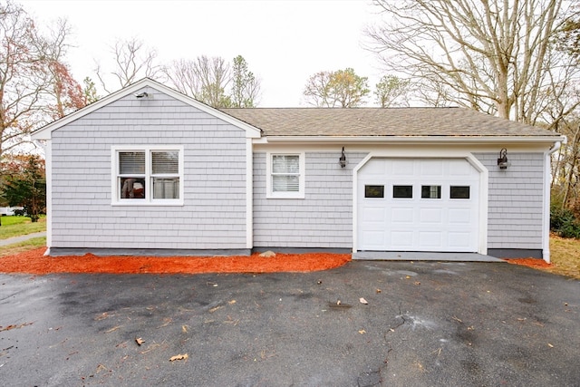 view of side of home with a garage