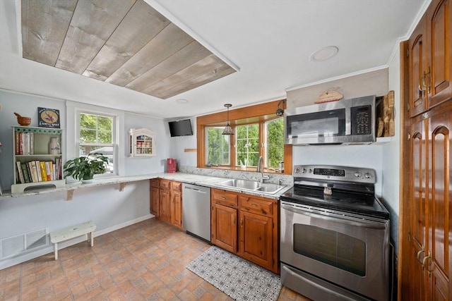 20 Harlem Rd, Weymouth, MA 02191 - kitchen with appliances with stainless steel finishes, a sink, baseboards, and plenty of natural light