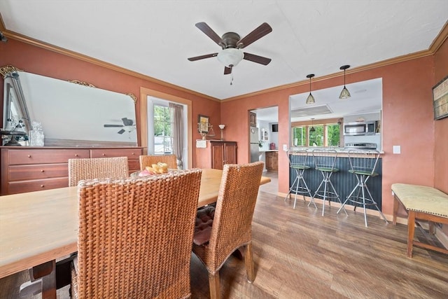 20 Harlem Rd, Weymouth, MA 02191 - dining room with wood finished floors, a ceiling fan, ornamental molding, and baseboards