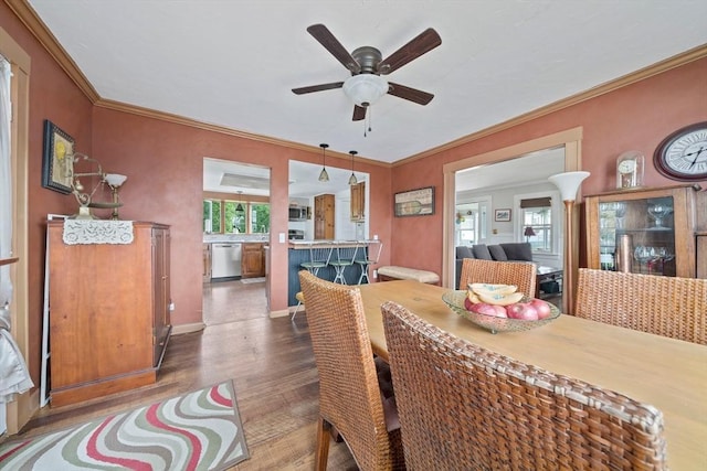 20 Harlem Rd, Weymouth, MA 02191 - dining area with a ceiling fan, wood finished floors, ornamental molding, and baseboards