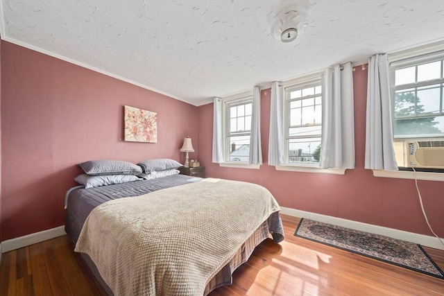 20 Harlem Rd, Weymouth, MA 02191 - bedroom with baseboards, wood finished floors, cooling unit, and a textured ceiling
