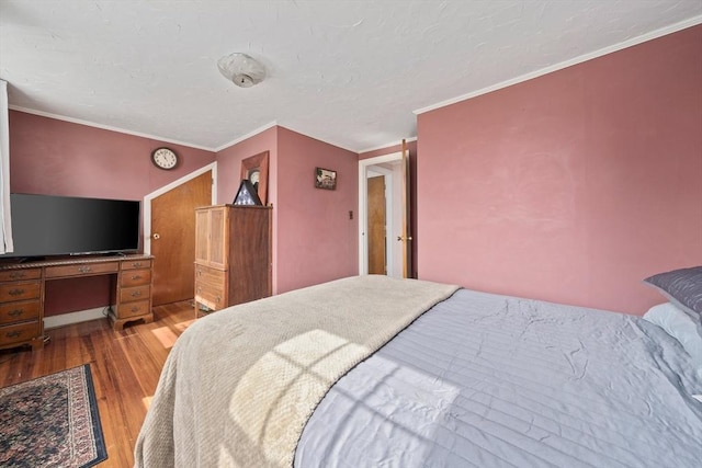 20 Harlem Rd, Weymouth, MA 02191 - bedroom featuring wood finished floors, crown molding, a desk, and a textured ceiling
