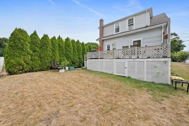 20 Harlem Rd, Weymouth, MA 02191 - rear view of house featuring a yard, a chimney, and a deck