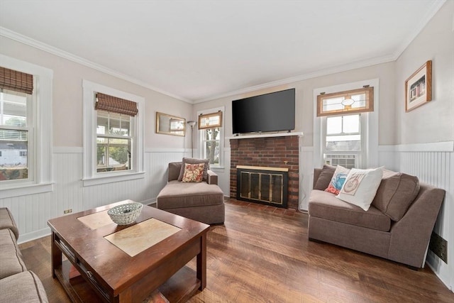 20 Harlem Rd, Weymouth, MA 02191 - living room featuring a wainscoted wall, wood finished floors, crown molding, and a brick fireplace