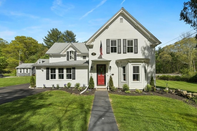 view of front of house featuring a front yard and driveway