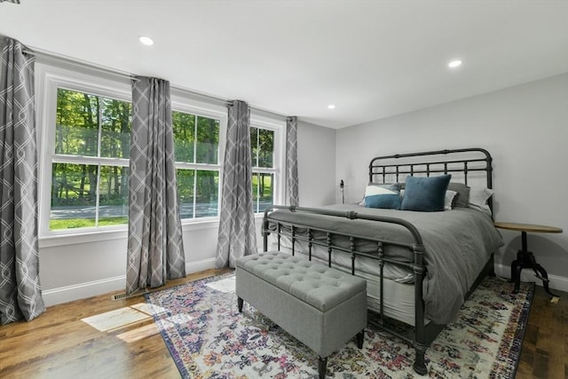 bedroom featuring recessed lighting, baseboards, and wood finished floors