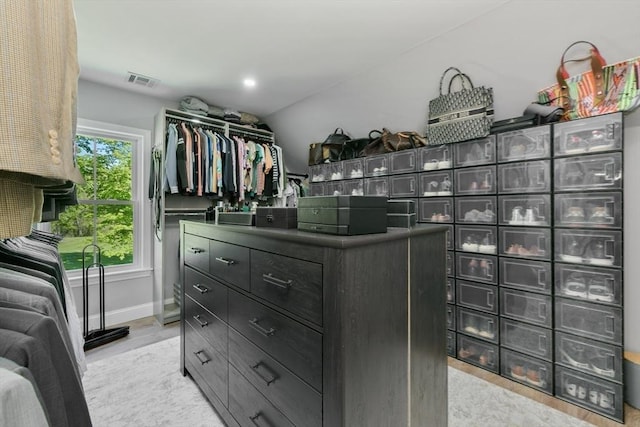 walk in closet featuring light wood-style flooring and visible vents