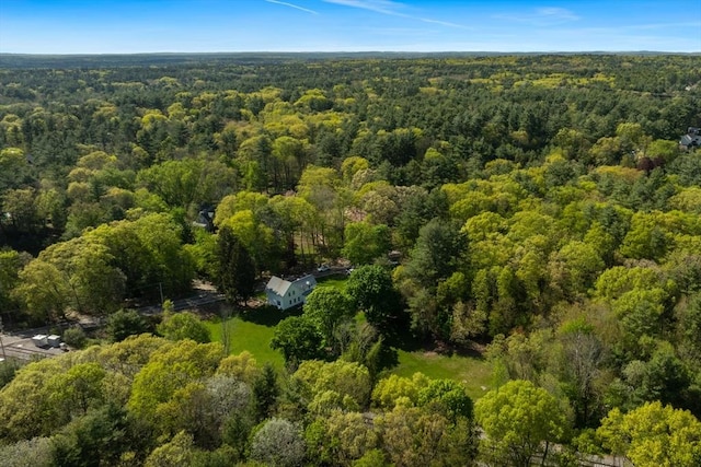 drone / aerial view featuring a forest view