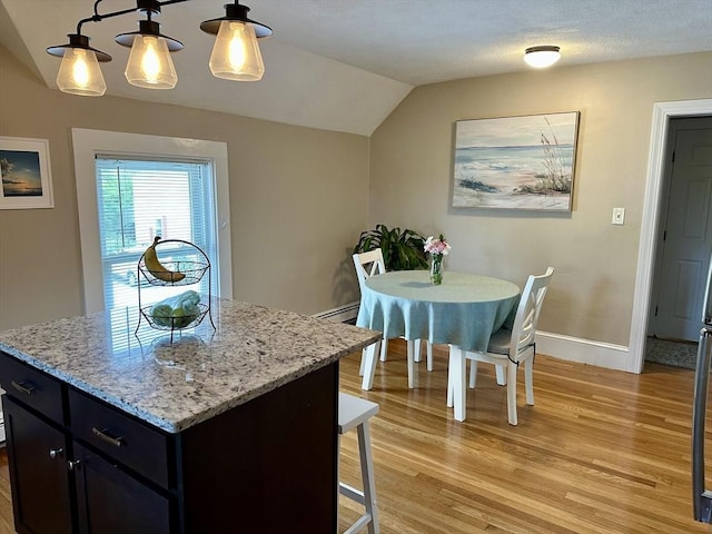 3 Centre St, Waltham, MA 02453 - dining space featuring lofted ceiling, light wood-style flooring, and baseboards