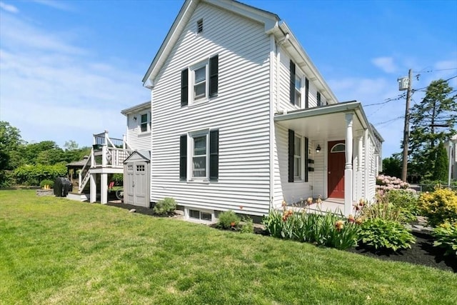3 Centre St, Waltham, MA 02453 - back of property with a yard and stairway