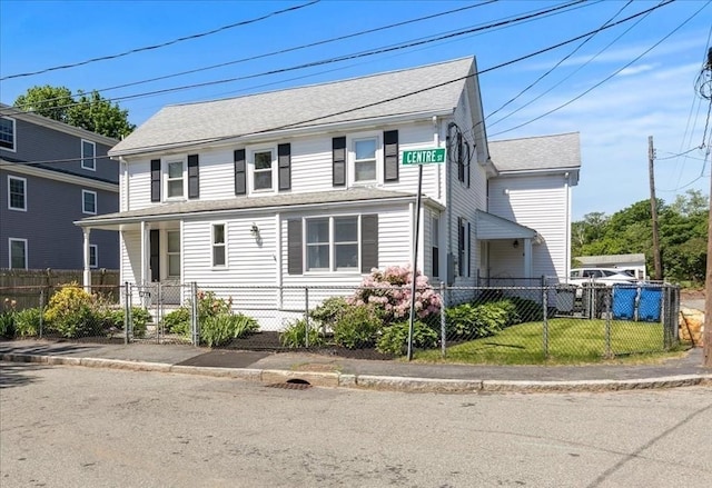 3 Centre St, Waltham, MA 02453 - view of front of house featuring a fenced front yard, a gate, and roof with shingles