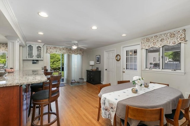 3 Centre St, Waltham, MA 02453 - dining area featuring ornamental molding, light wood-style floors, a ceiling fan, recessed lighting, and ornate columns