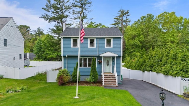 54 Forest St, Wilmington, MA 01887 - colonial house featuring a chimney