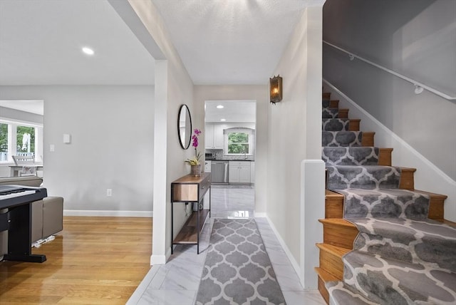 54 Forest St, Wilmington, MA 01887 - stairs featuring healthy amount of natural light, baseboards, and recessed lighting