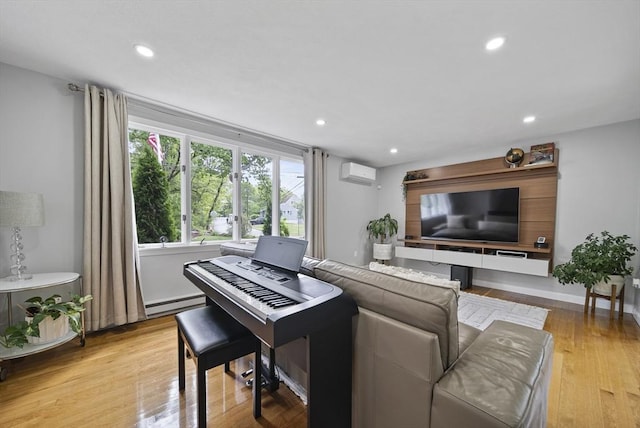 54 Forest St, Wilmington, MA 01887 - living area featuring a wall mounted AC, light wood-type flooring, a baseboard radiator, and recessed lighting