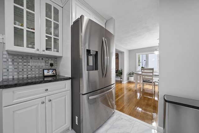 54 Forest St, Wilmington, MA 01887 - kitchen featuring stainless steel refrigerator with ice dispenser, white cabinets, and glass insert cabinets