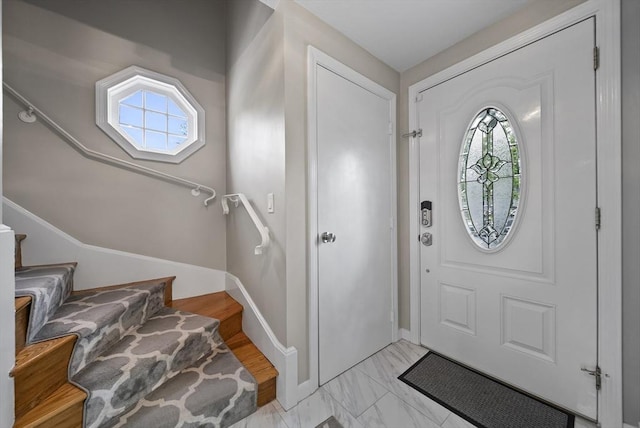 54 Forest St, Wilmington, MA 01887 - entryway with healthy amount of natural light, stairs, and baseboards