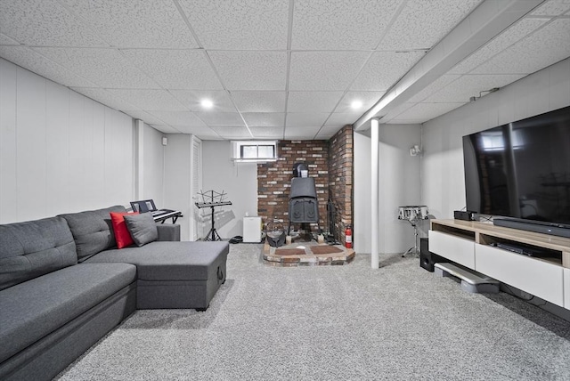 54 Forest St, Wilmington, MA 01887 - carpeted living room with a wood stove, a paneled ceiling, and recessed lighting