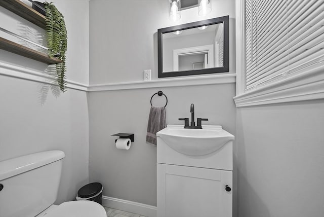 54 Forest St, Wilmington, MA 01887 - half bath featuring vanity, toilet, and baseboards