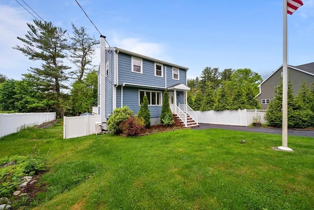 54 Forest St, Wilmington, MA 01887 - rear view of house featuring a chimney