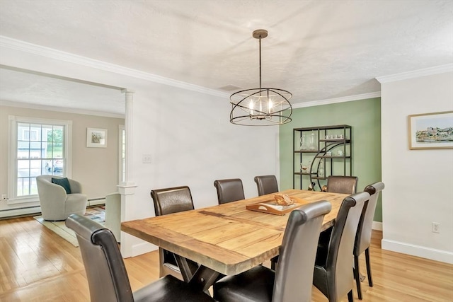 10 Ballard Ter, Lexington, MA 02420 - dining room featuring a baseboard heating unit, a chandelier, light wood-style flooring, baseboards, and ornamental molding