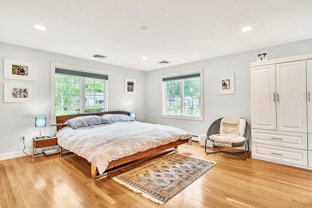 10 Ballard Ter, Lexington, MA 02420 - bedroom featuring multiple windows, light wood-style floors, recessed lighting, baseboards, and a baseboard radiator