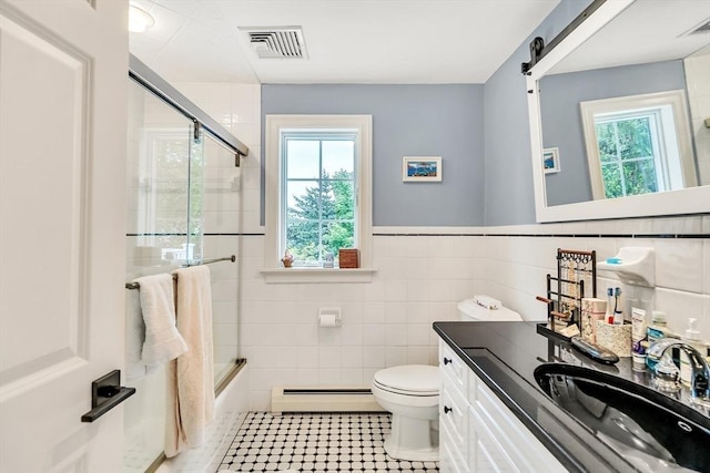 10 Ballard Ter, Lexington, MA 02420 - bathroom with baseboard heating, tile walls, toilet, plenty of natural light, and vanity