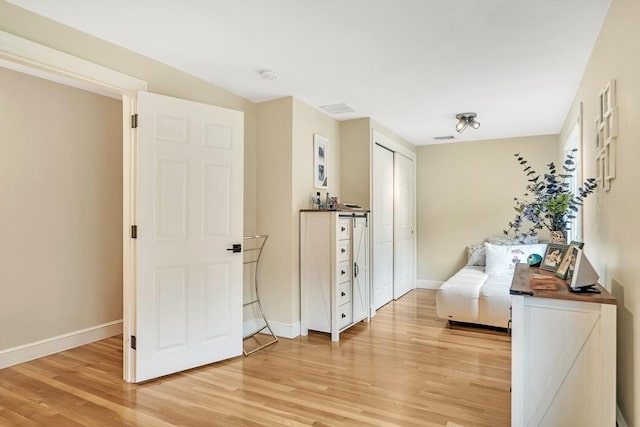 10 Ballard Ter, Lexington, MA 02420 - bedroom with light wood finished floors, baseboards, and a closet