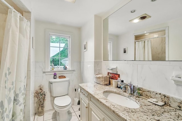 10 Ballard Ter, Lexington, MA 02420 - bathroom with tile walls, toilet, vanity, tile patterned floors, and curtained shower