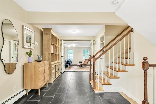 10 Ballard Ter, Lexington, MA 02420 - foyer featuring a baseboard radiator, stairs, and baseboards