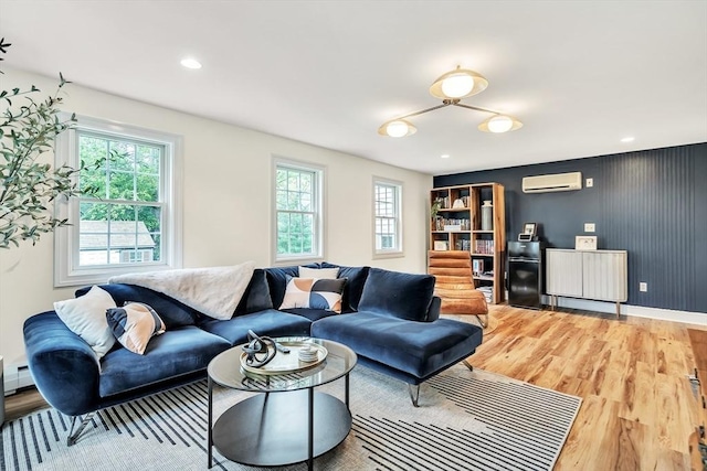10 Ballard Ter, Lexington, MA 02420 - living room featuring a wall mounted AC, wood finished floors, radiator heating unit, baseboards, and recessed lighting