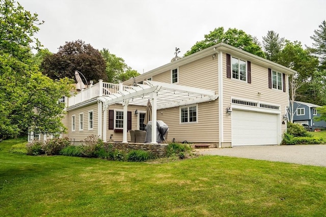 10 Ballard Ter, Lexington, MA 02420 - view of front of home with a pergola, a front lawn, an attached garage, and asphalt driveway