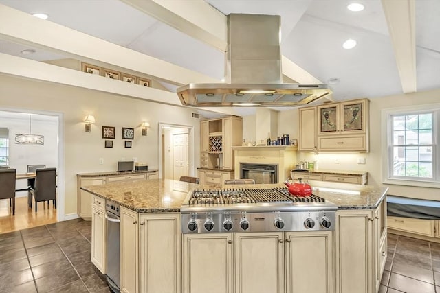 10 Ballard Ter, Lexington, MA 02420 - kitchen featuring cream cabinets, island exhaust hood, stainless steel gas cooktop, a kitchen island, and recessed lighting