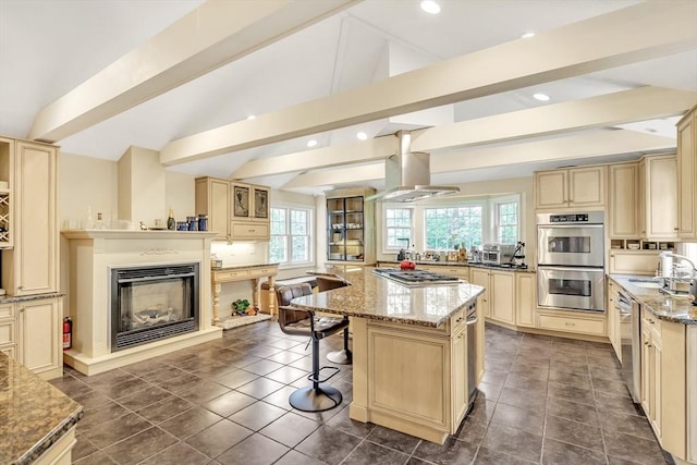 10 Ballard Ter, Lexington, MA 02420 - kitchen featuring cream cabinetry, stainless steel appliances, island range hood, a center island, and recessed lighting