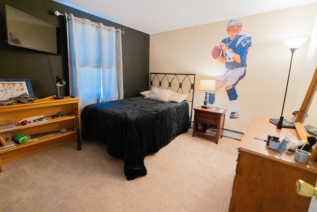 bedroom with a baseboard radiator and light colored carpet