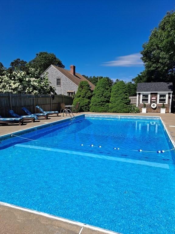 view of pool with an outdoor structure