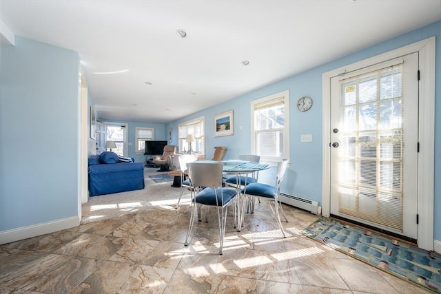 dining room featuring baseboard heating