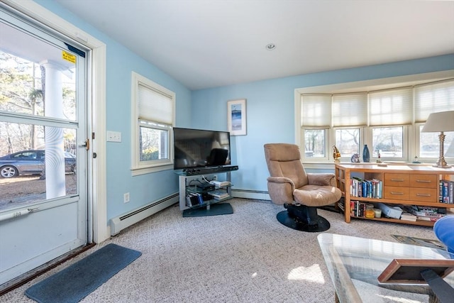 living room with a baseboard radiator and carpet floors