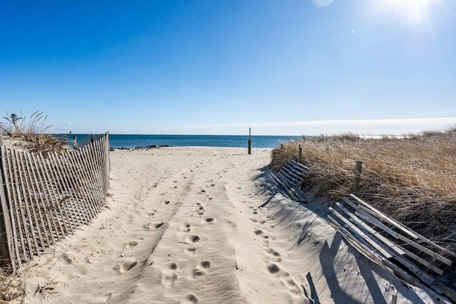 property view of water featuring a beach view